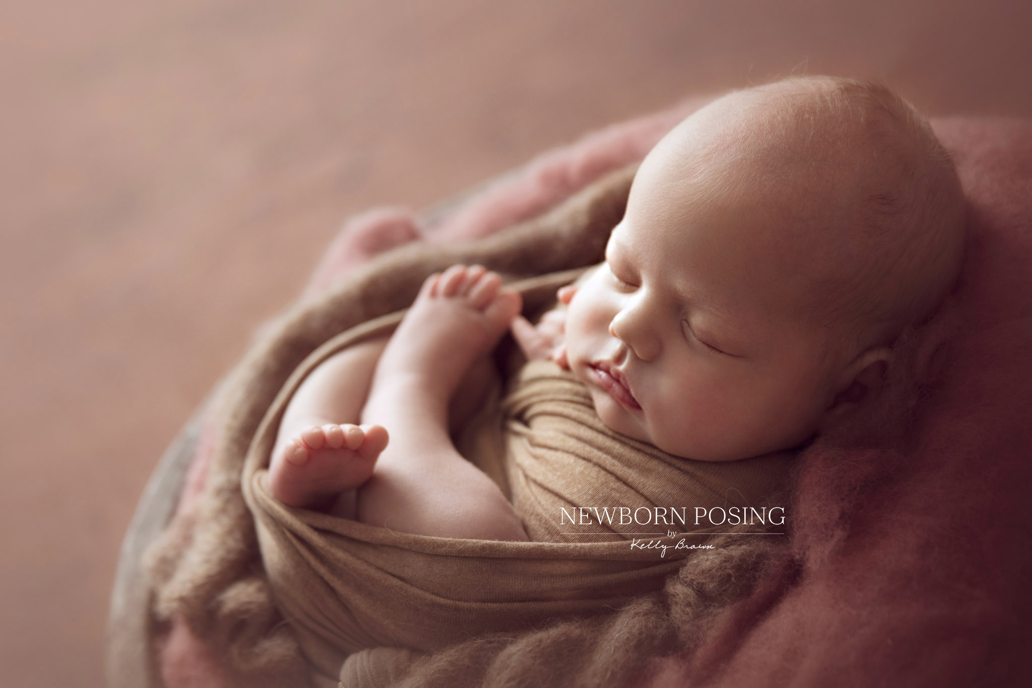 Newborn photography of a wrapped baby