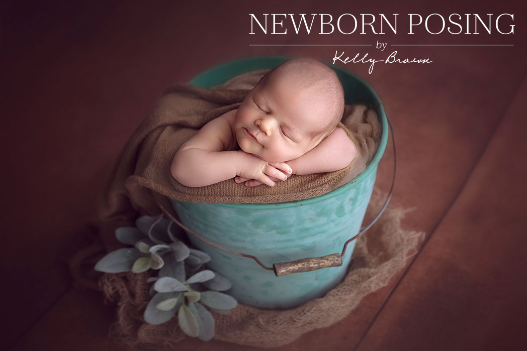 Newborn Posing Upright in Prop