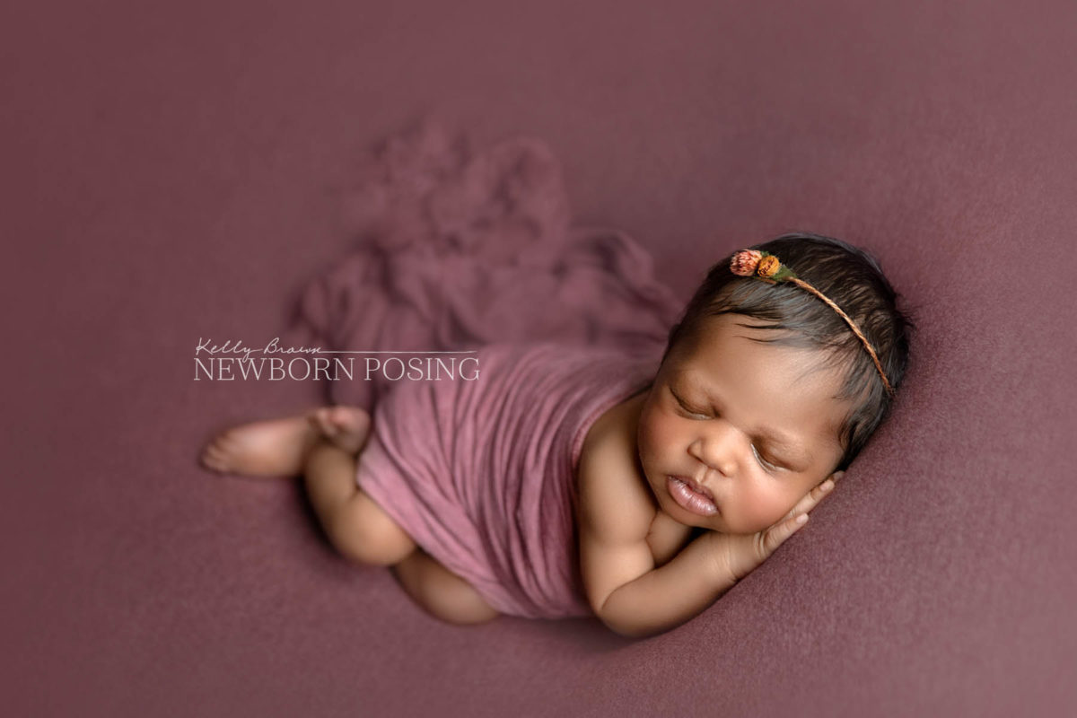 newborn portrait on posing bag by kelly brown